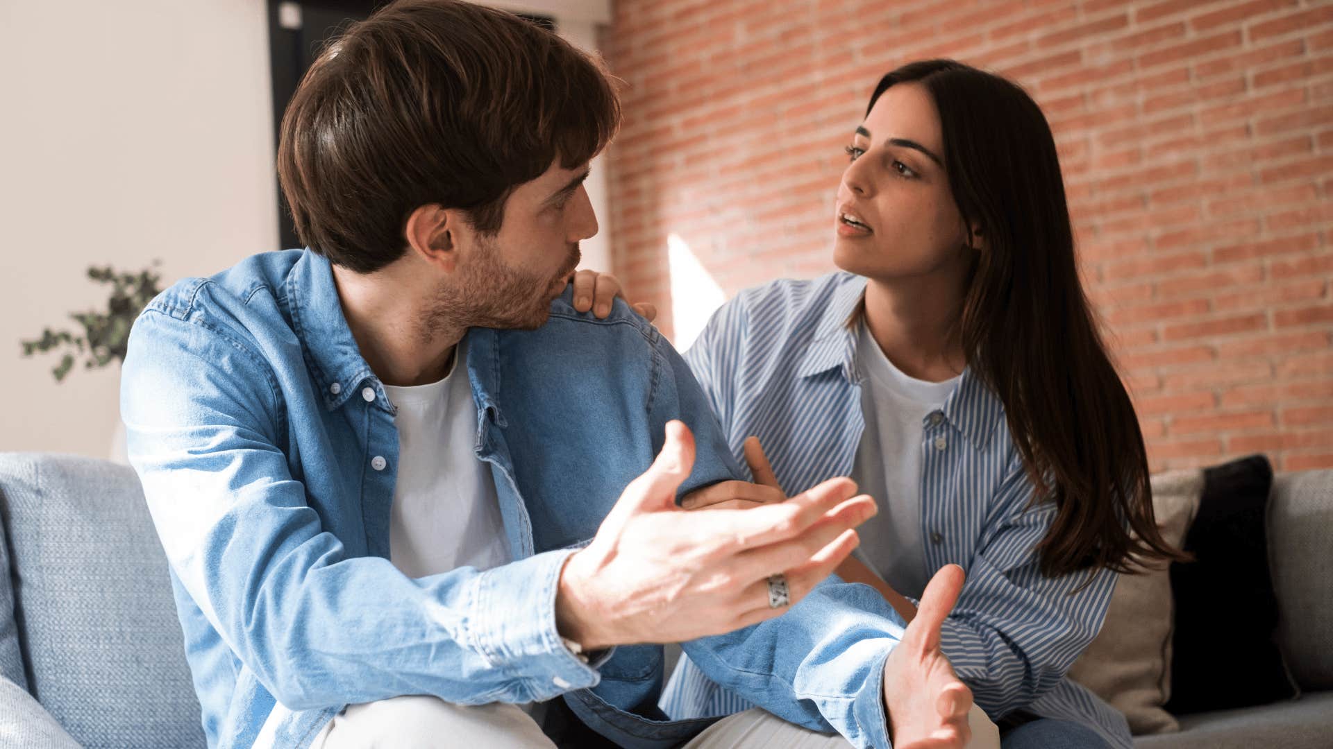 couple arguing on couch