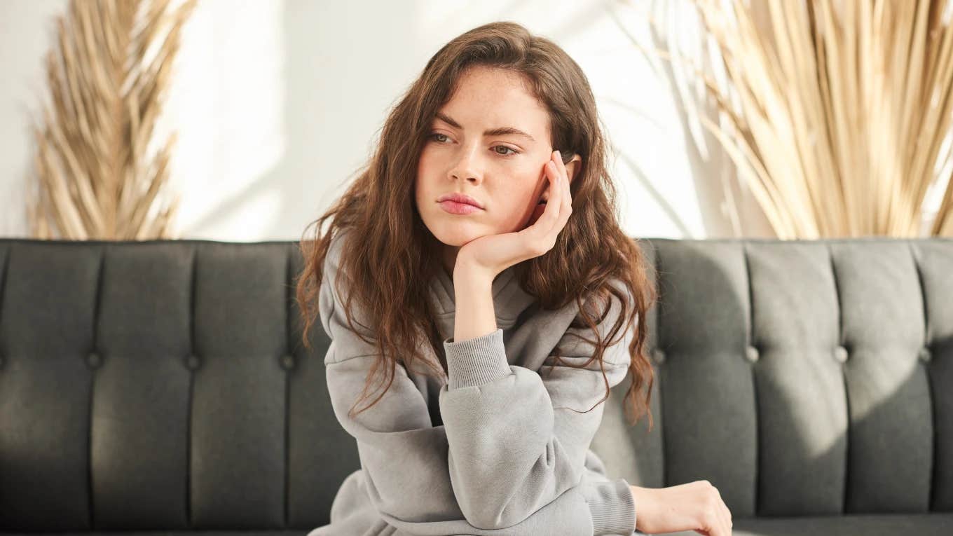 Woman thinking about how people shame women for men's failures