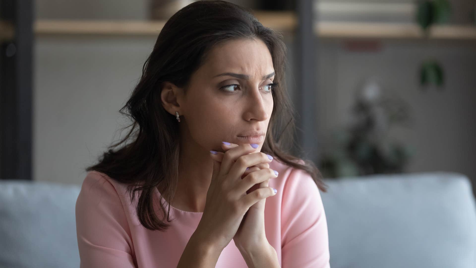 Anxious woman looking away from the camera.