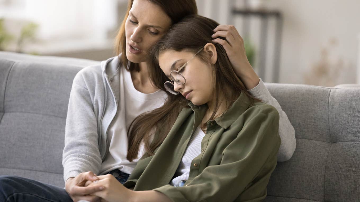 Mom comforting her daughter