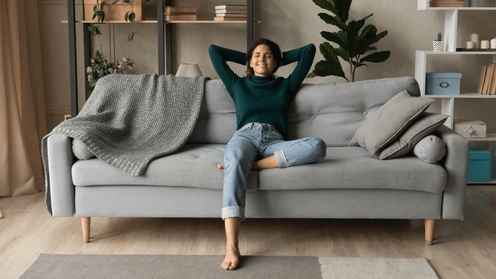 woman sitting alone on couch