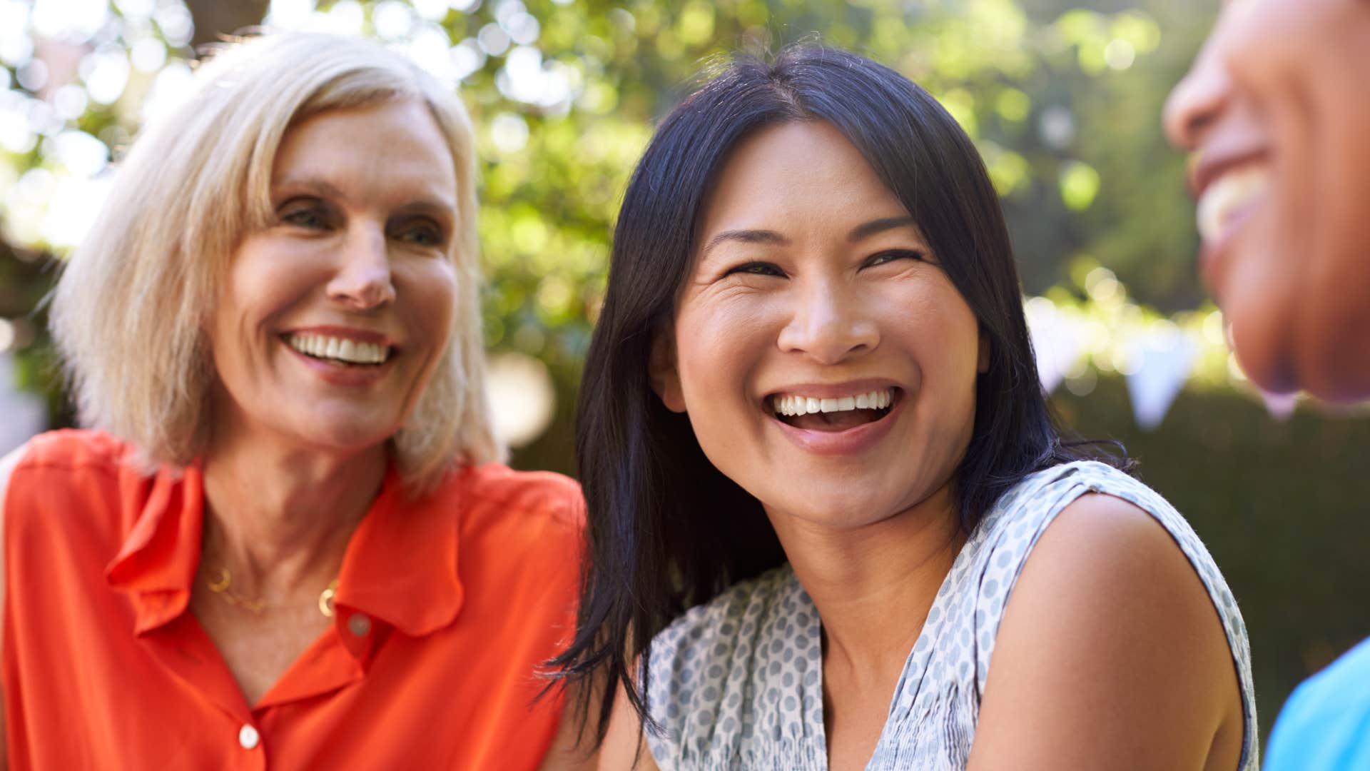 Two older women smiling and laughing.