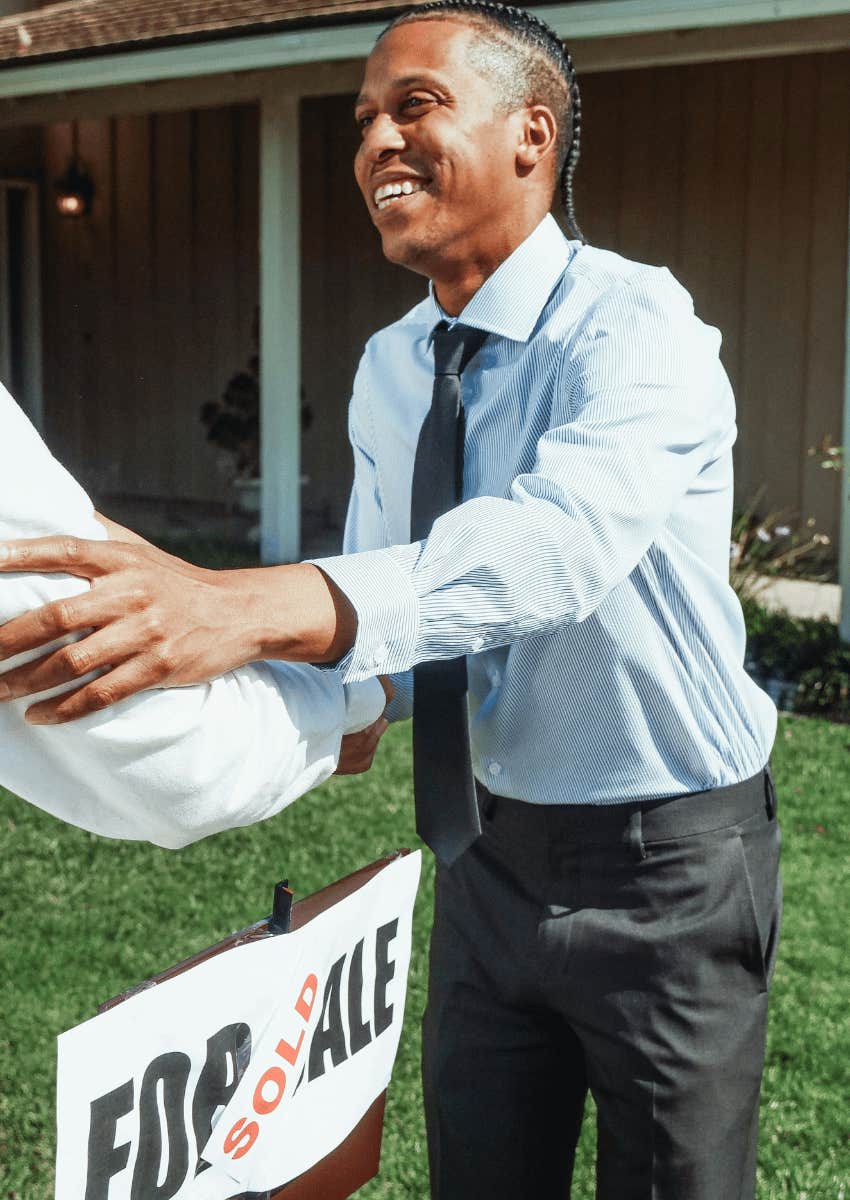 real estate agent congratulating a new homeowner