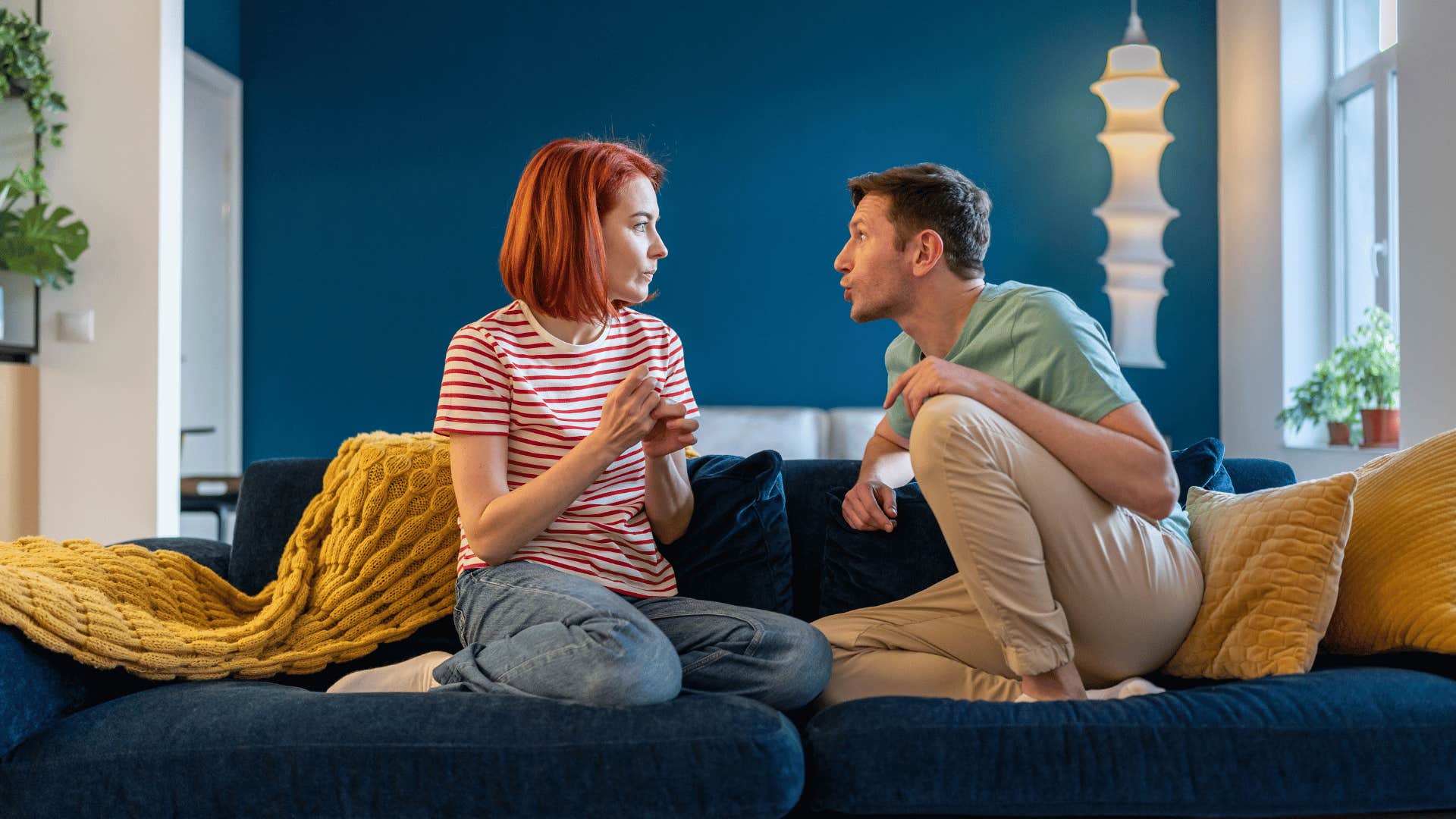 couple arguing on couch