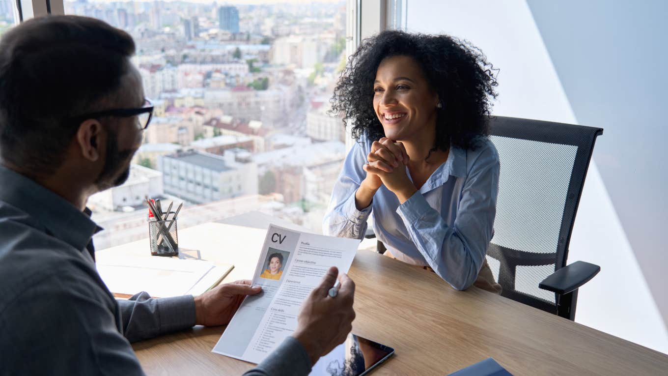 manager interviewing young woman in office