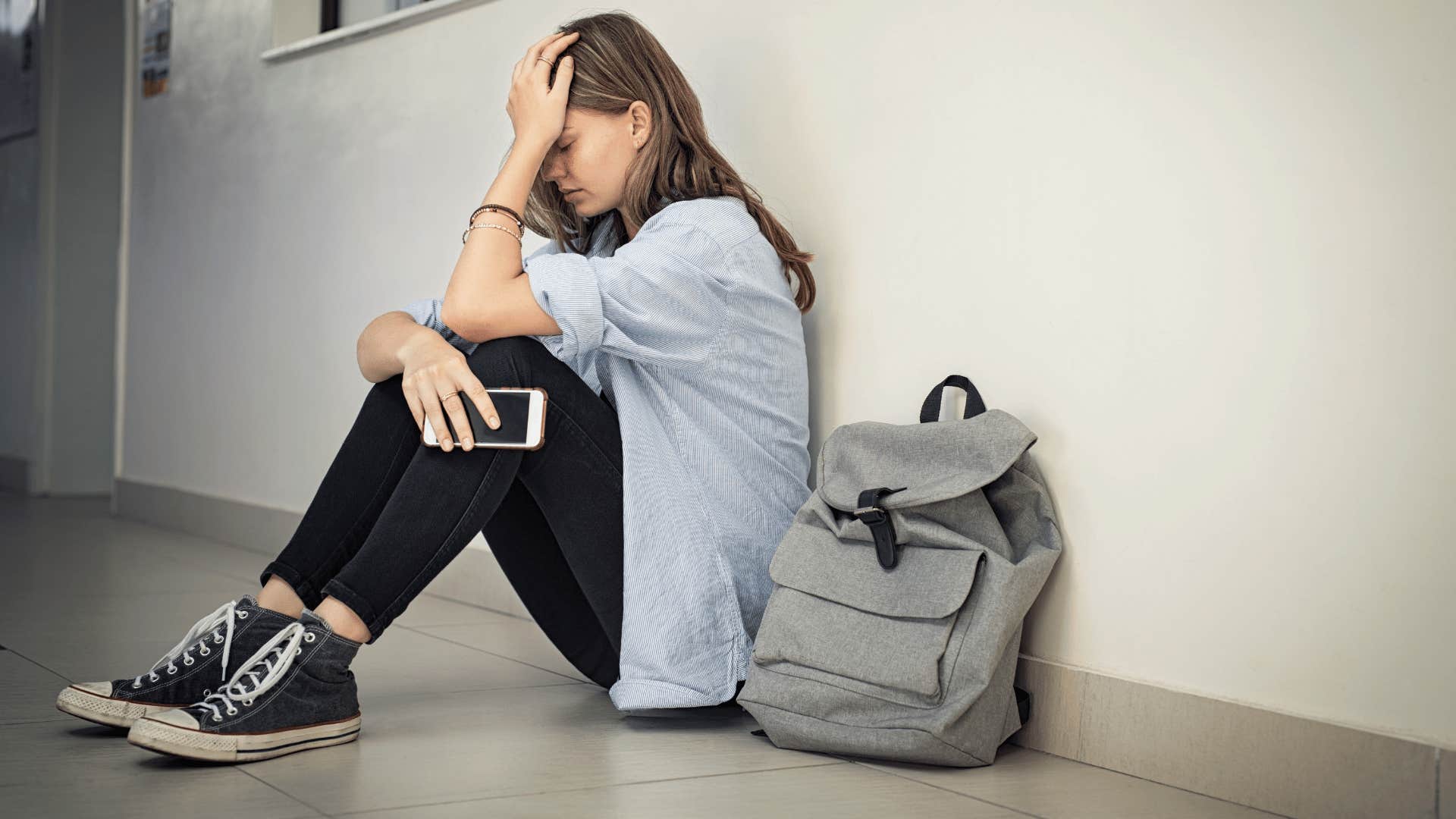 teen at school stressed out by pressure