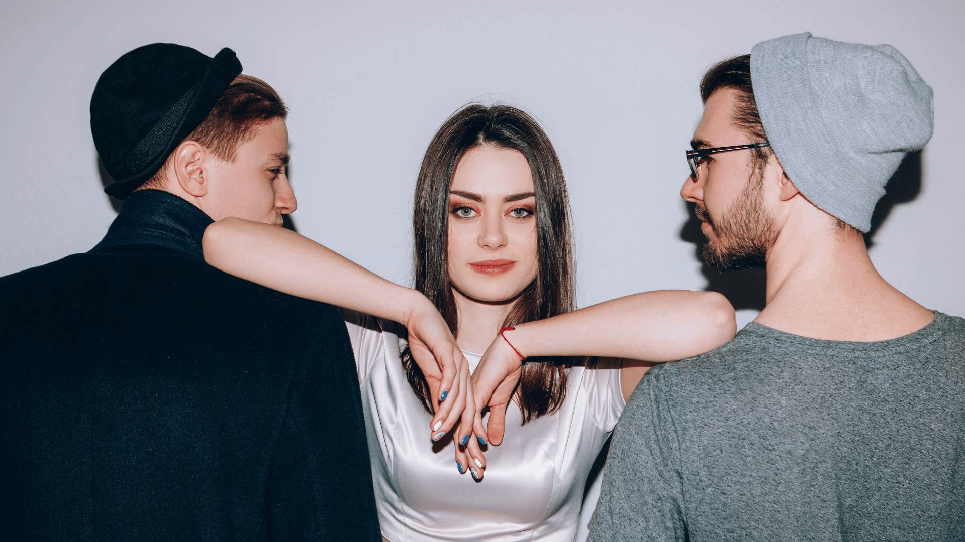 Woman stand between two men to set healthy boundaries