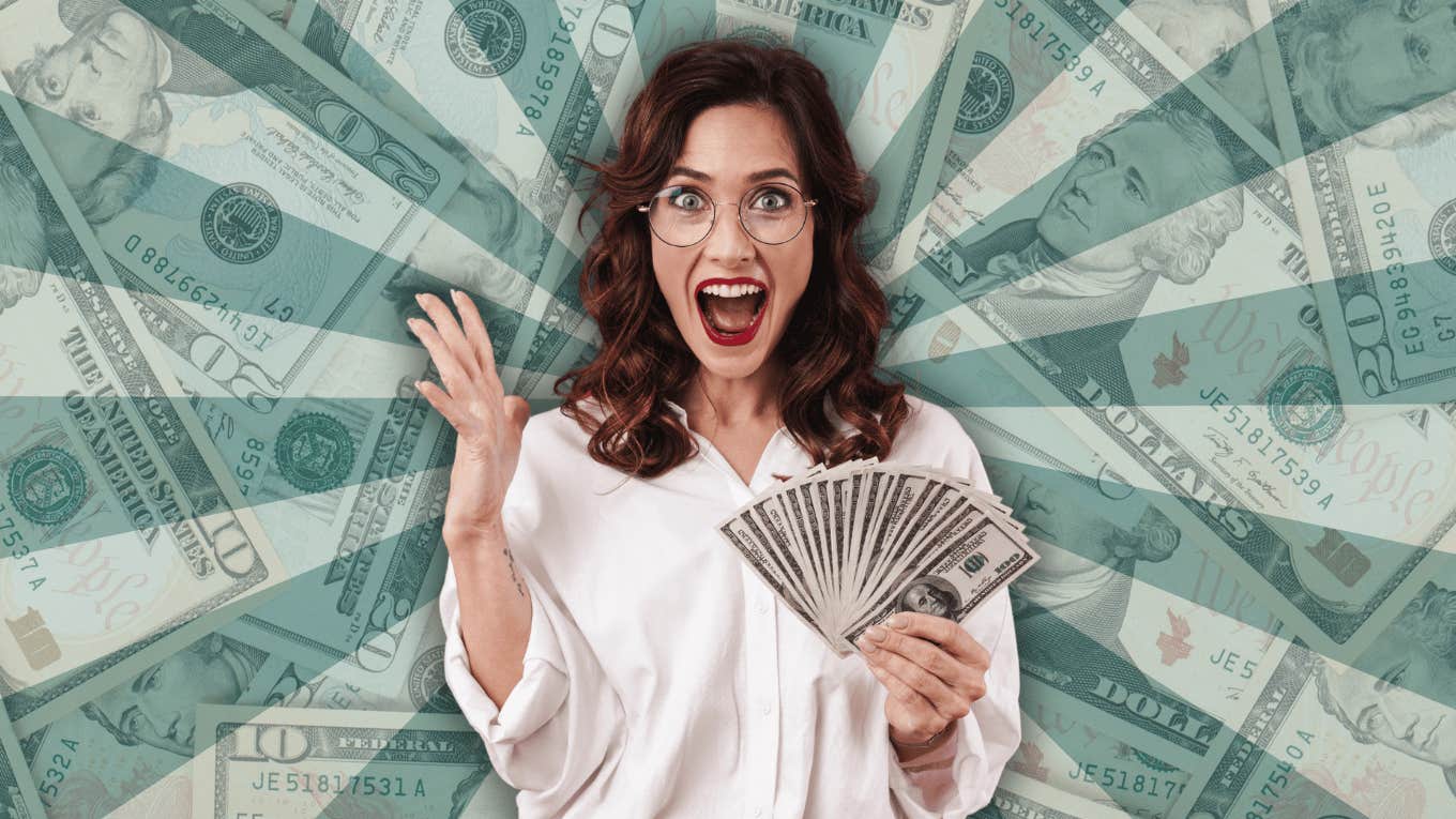 woman holding money in vortex sign quantum leaping income