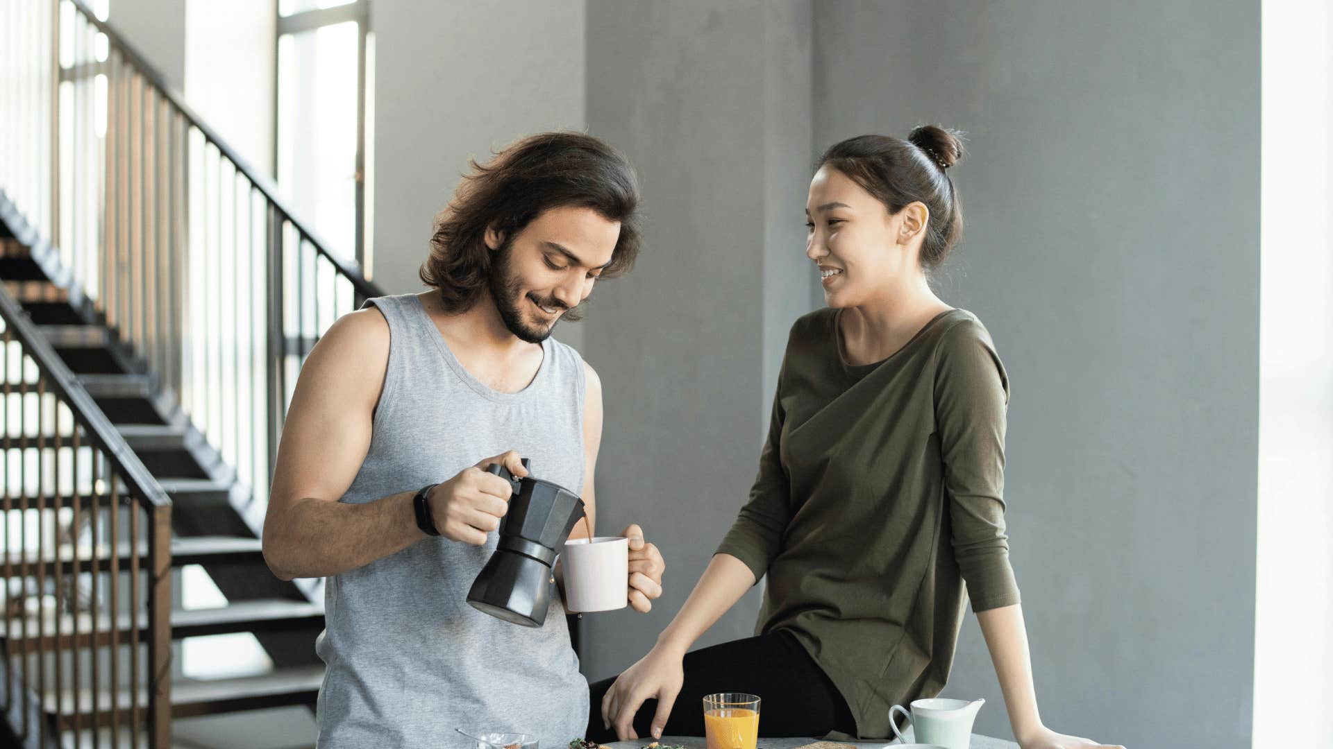 man pouring coffee while woman talks