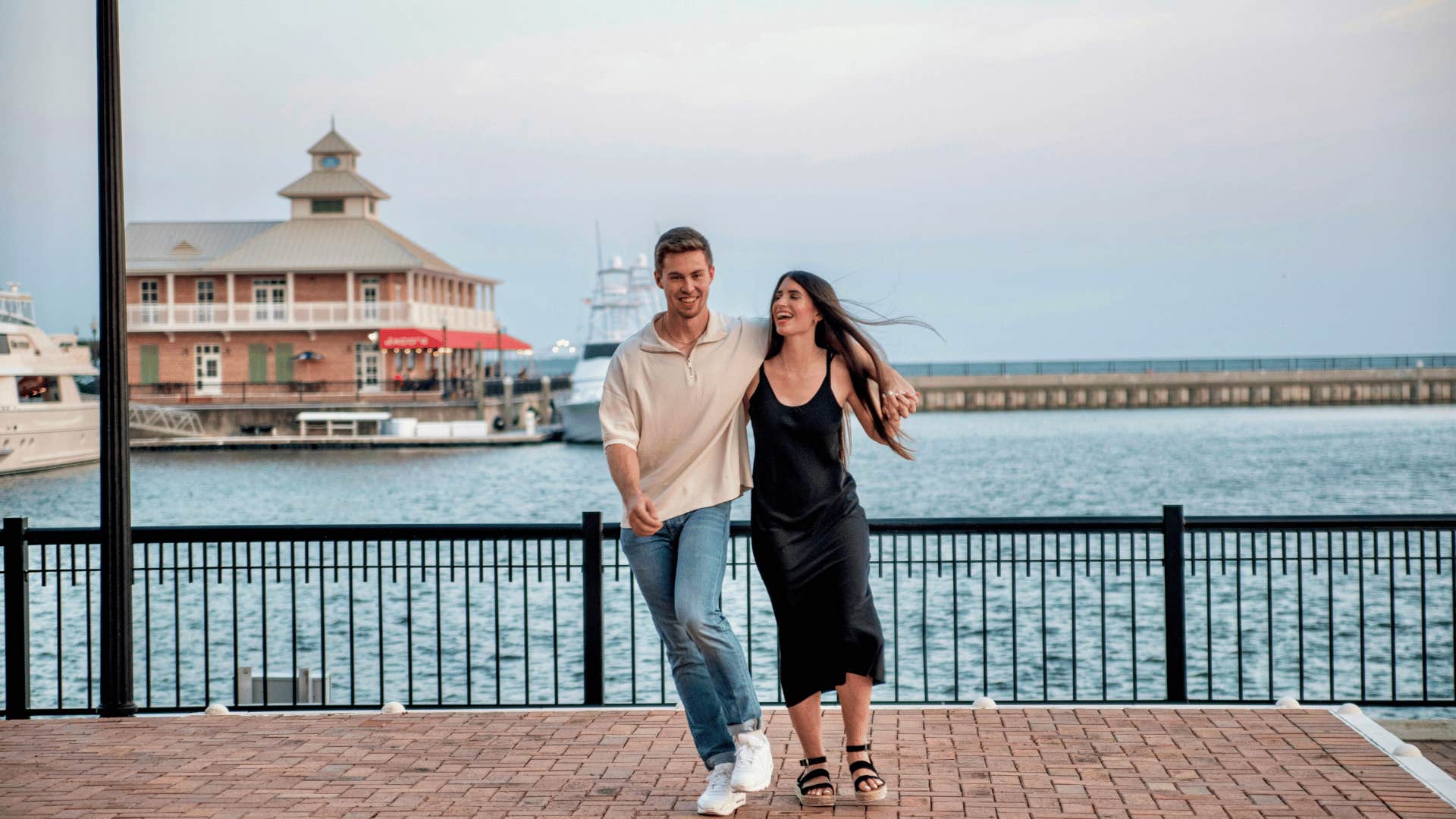 couple walking on boardwalk