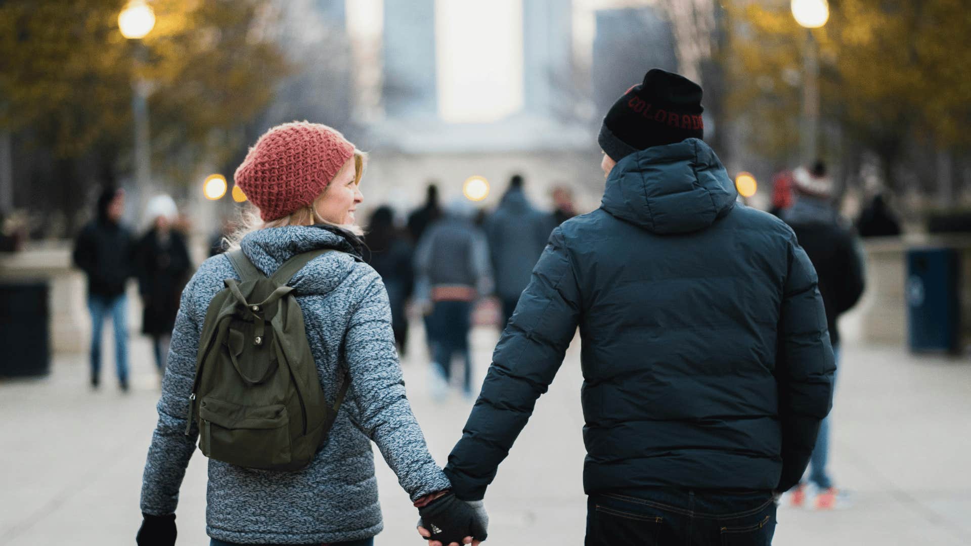 couple holding hands in a park