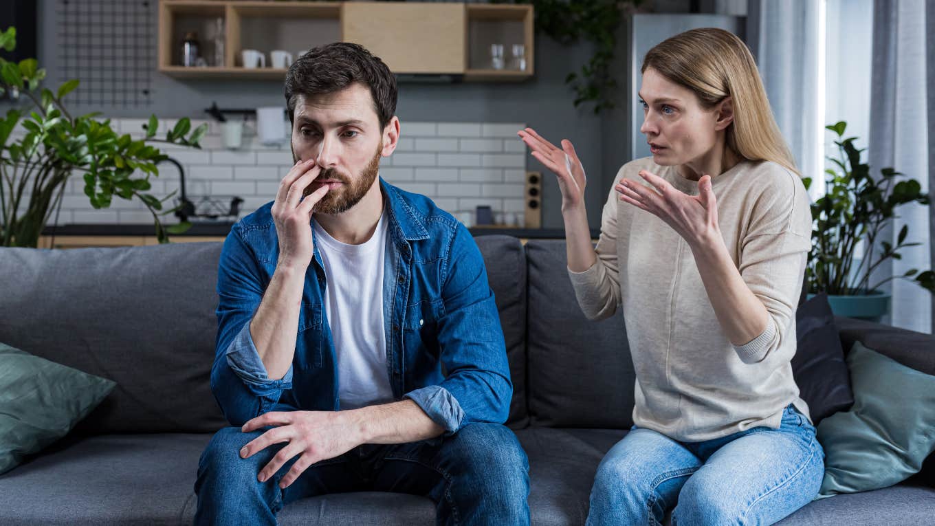 woman upset at man sitting silently