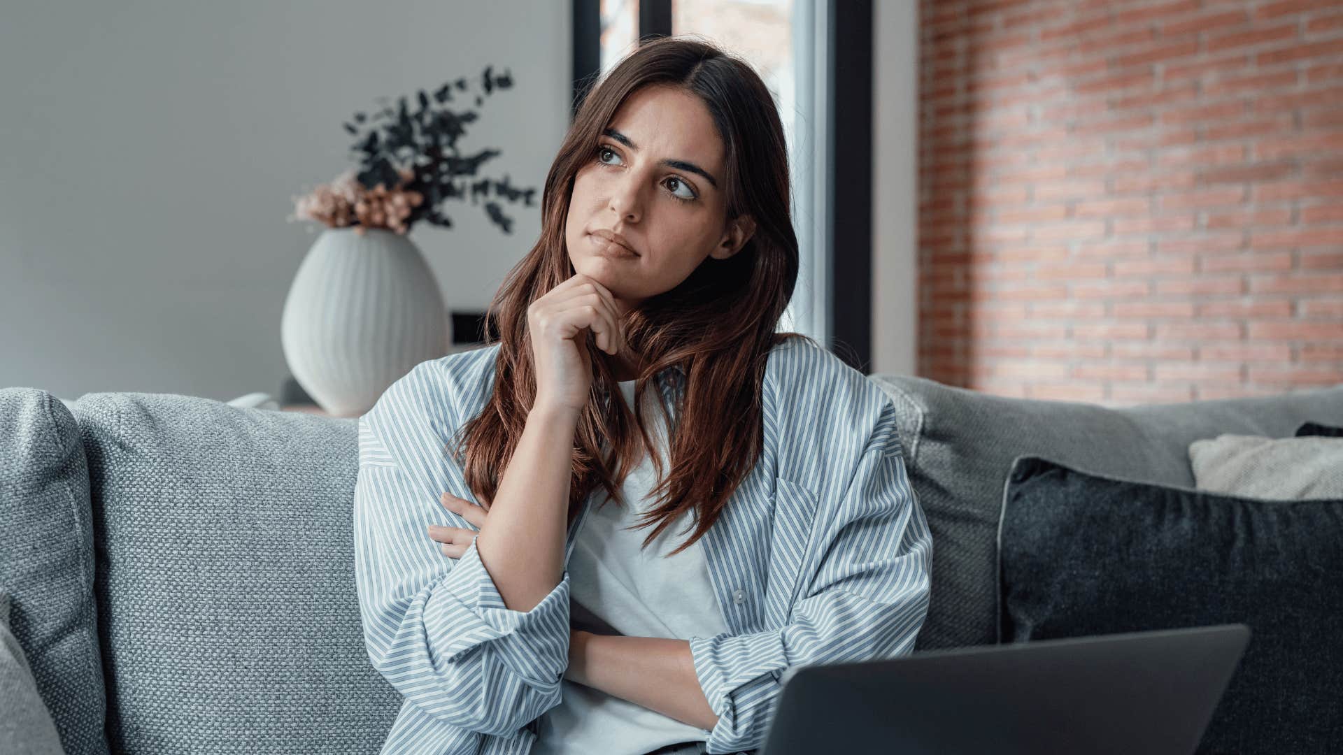 woman thinking while working