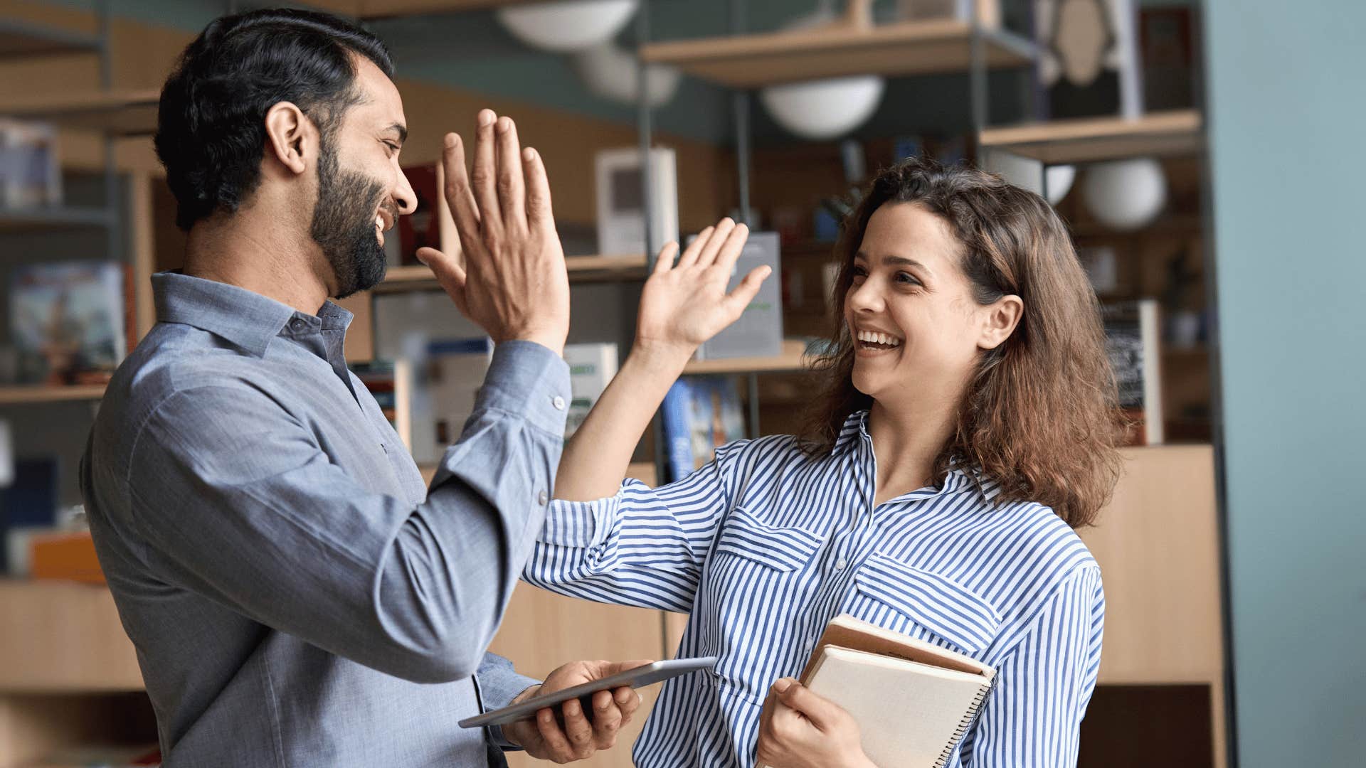 woman and man high fiving 