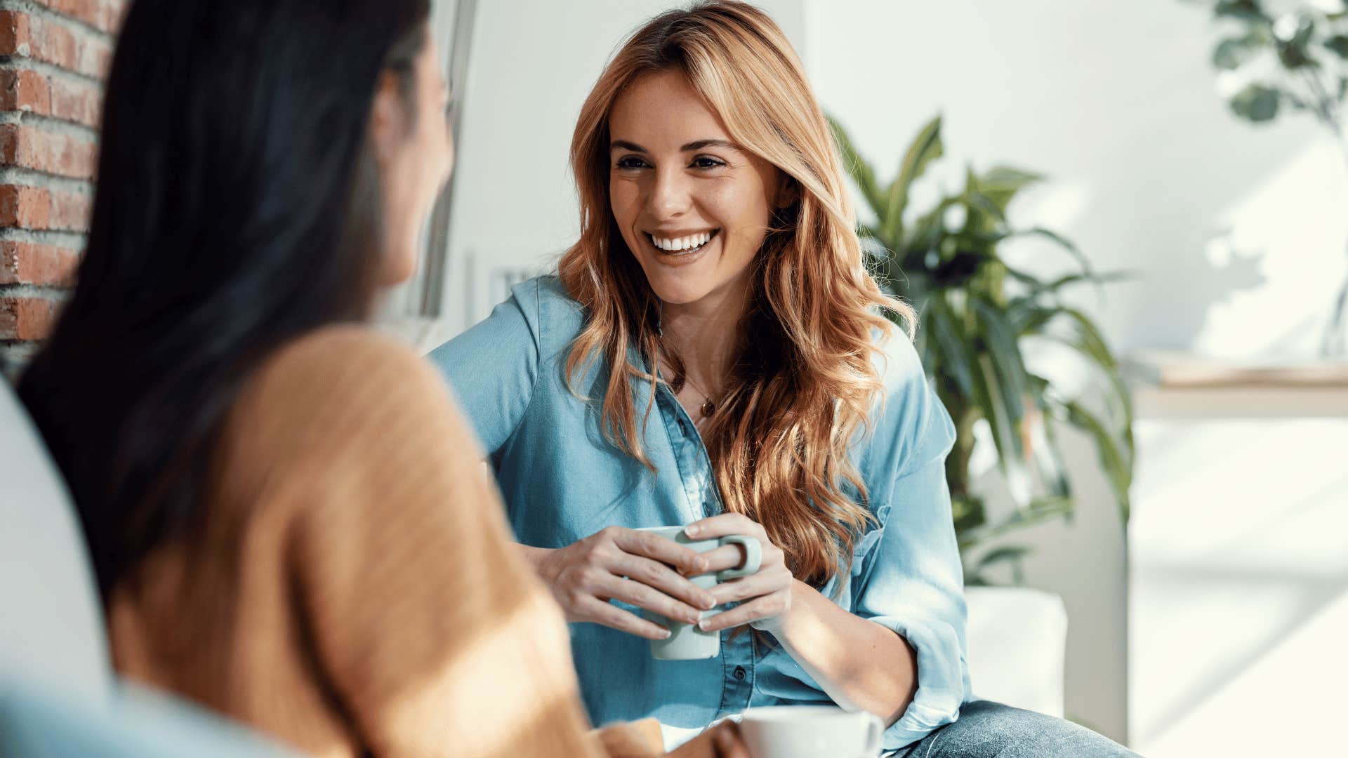 woman smiling at other woman 