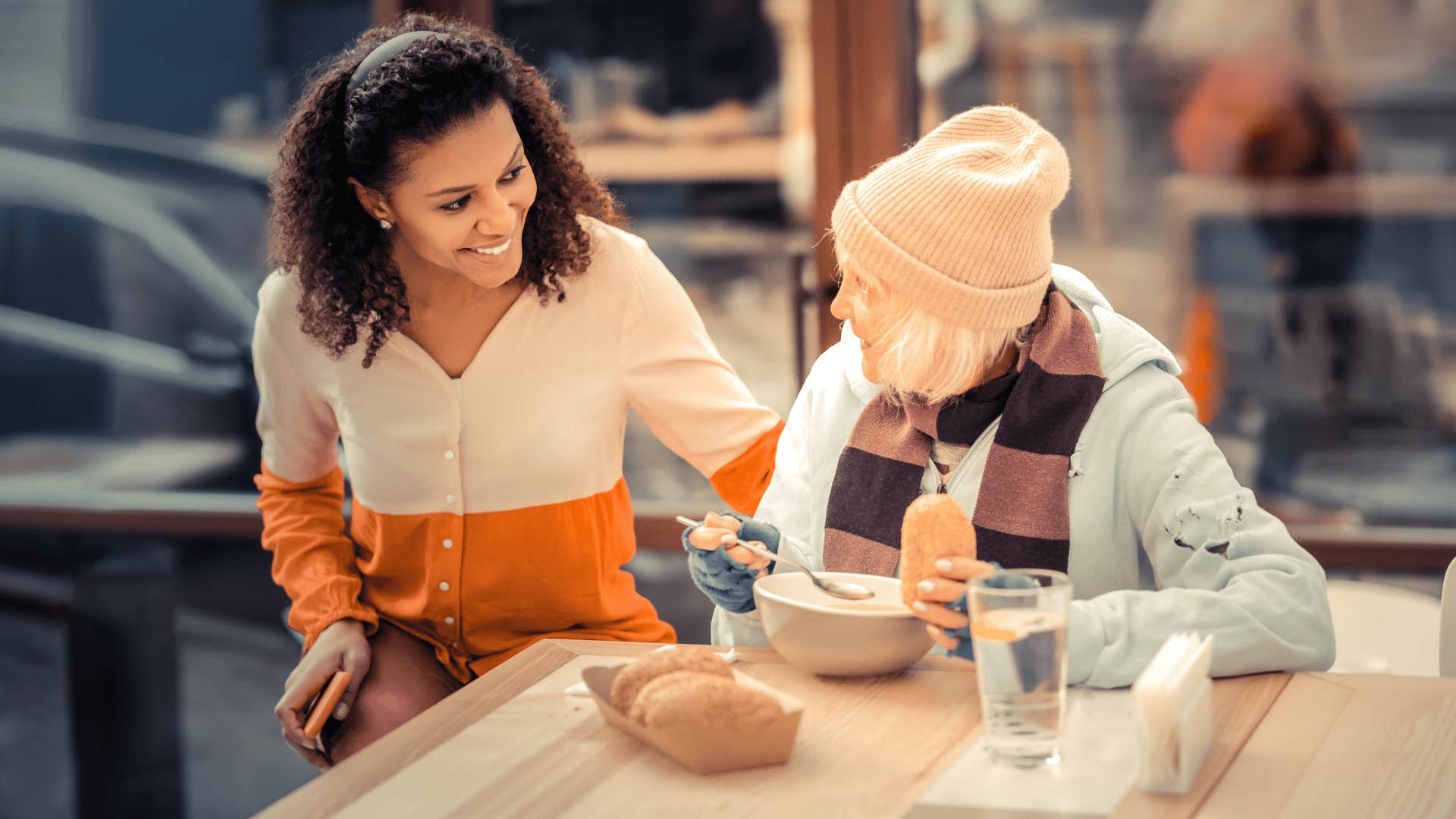 kind woman helping other woman in need