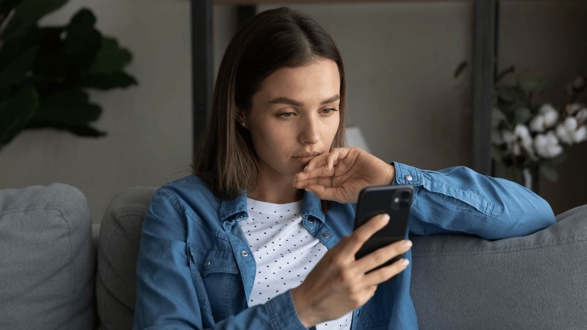 woman looking at her phone