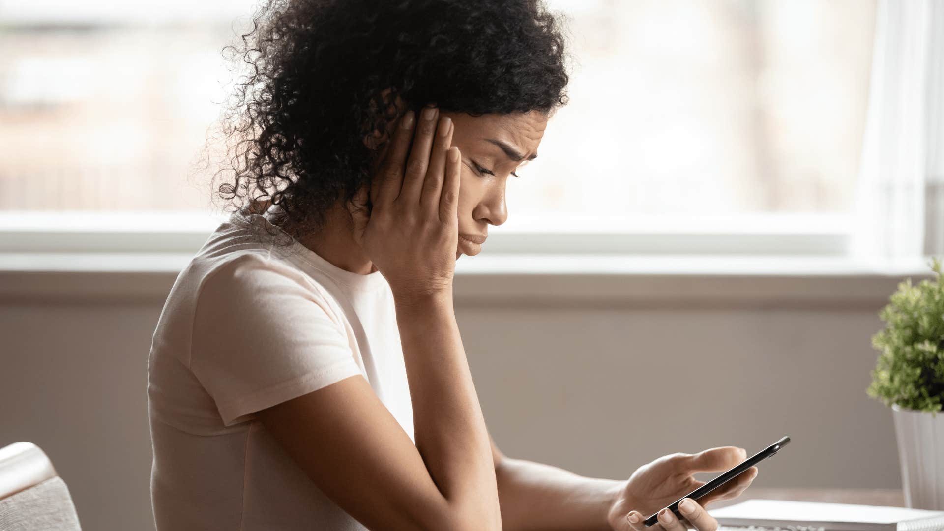 woman looking at her phone