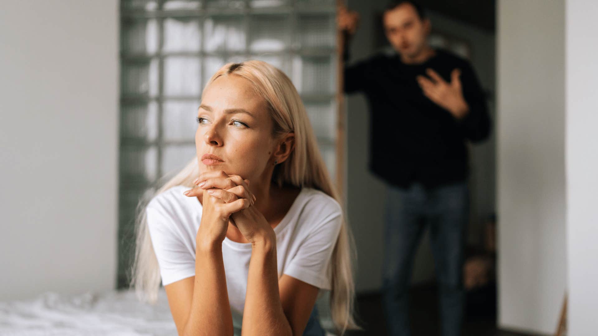 man arguing with woman that's ignoring him