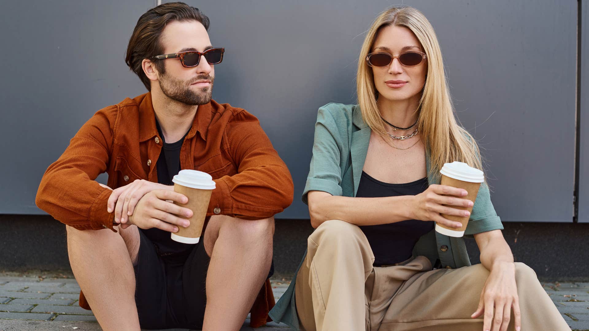 Two friends sitting and drinking coffee together.