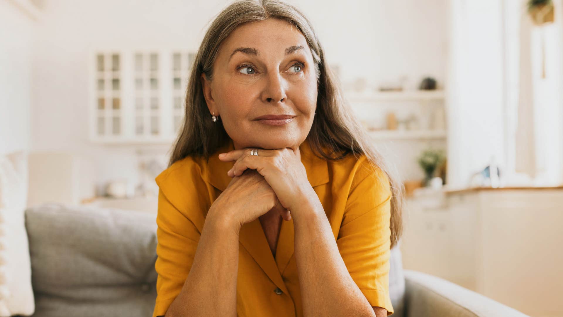 Older woman looking calm and happy.