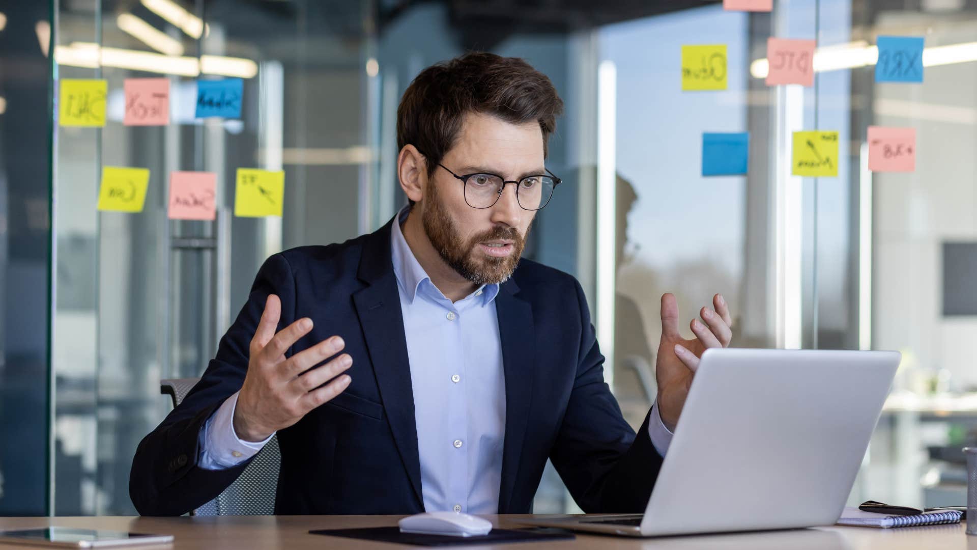 Professional man looking stressed in his work office.