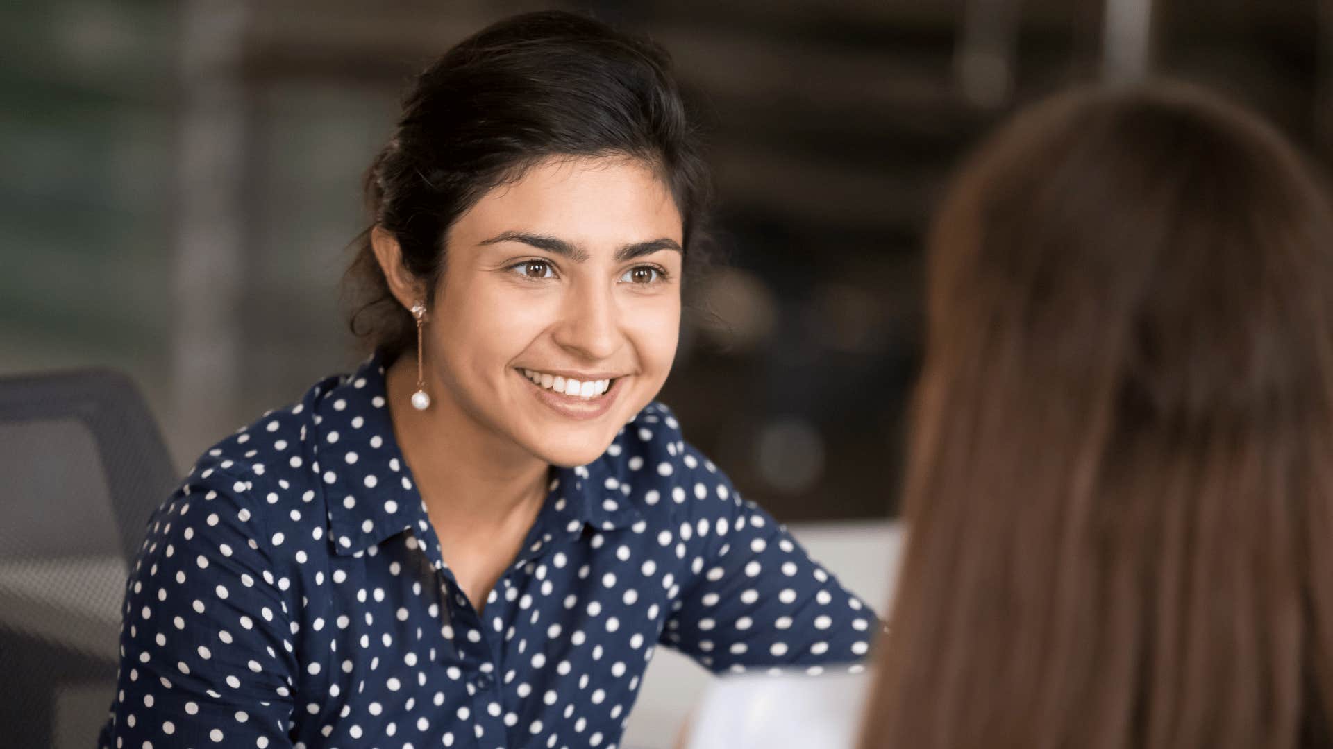 woman smiling at other woman