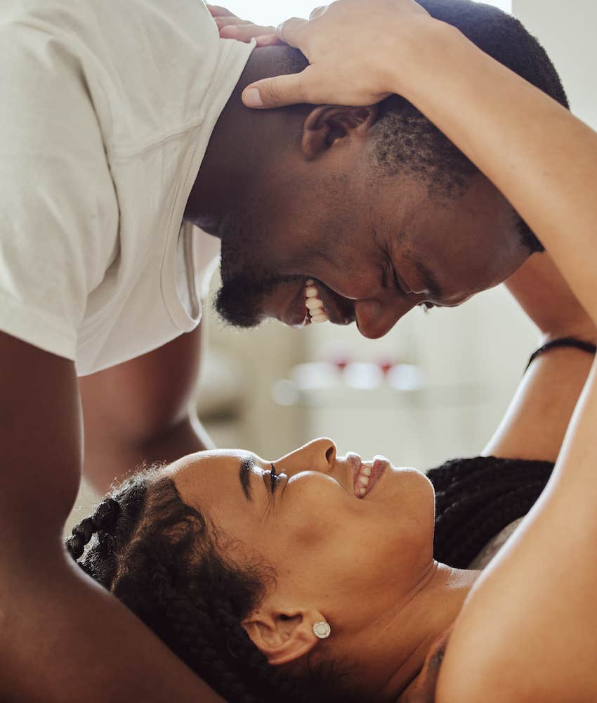 Couple looks into each other's eyes and smiles