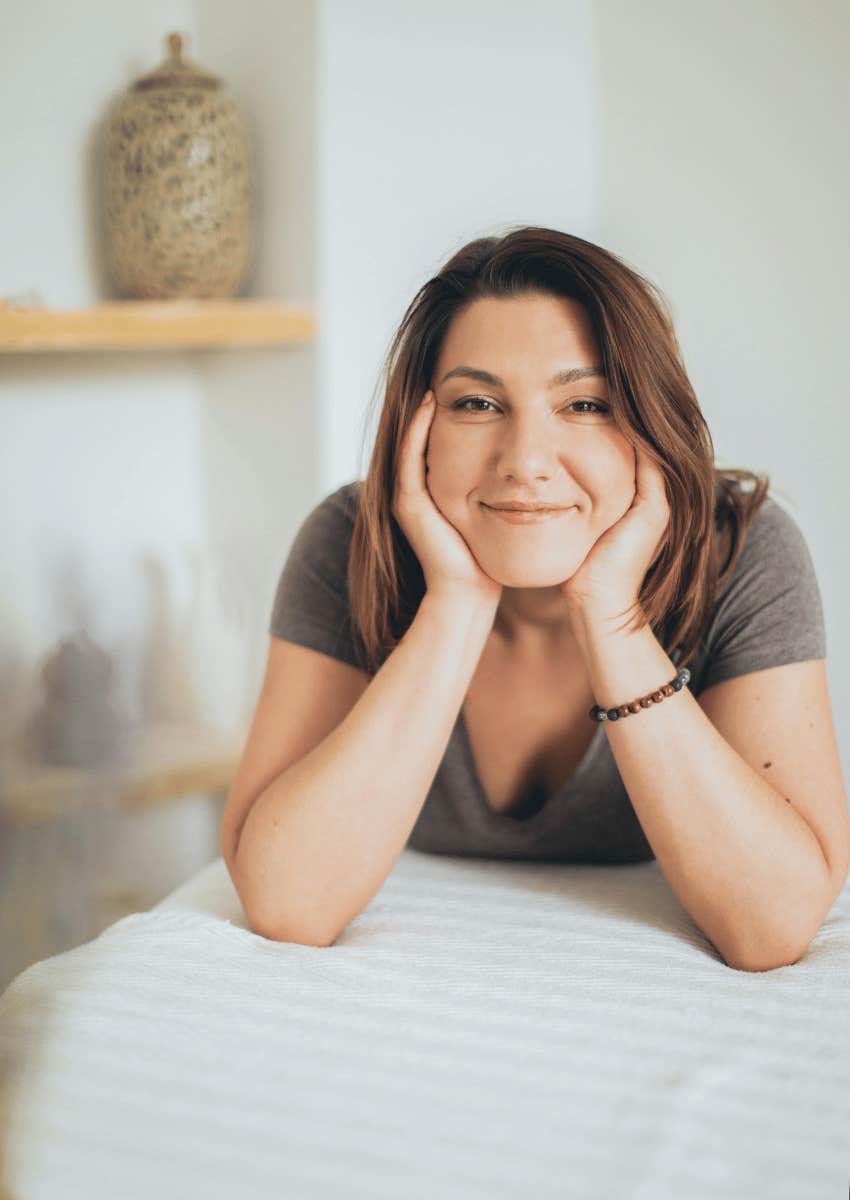 smiling woman on a massage table