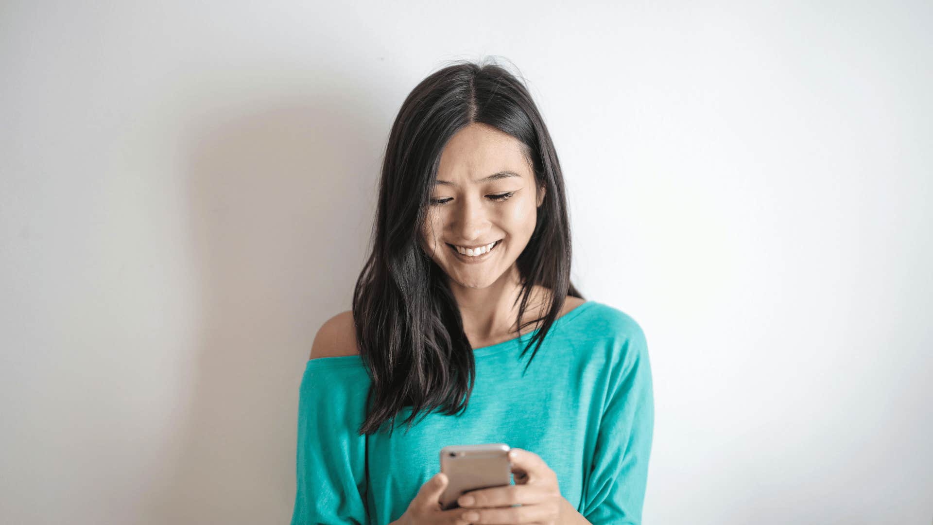 woman smiling on phone