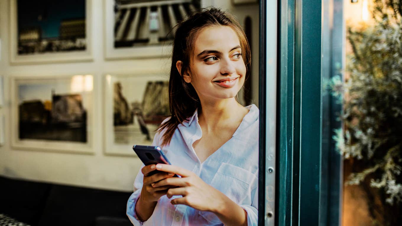 Woman texting a guy online, and being asked out.