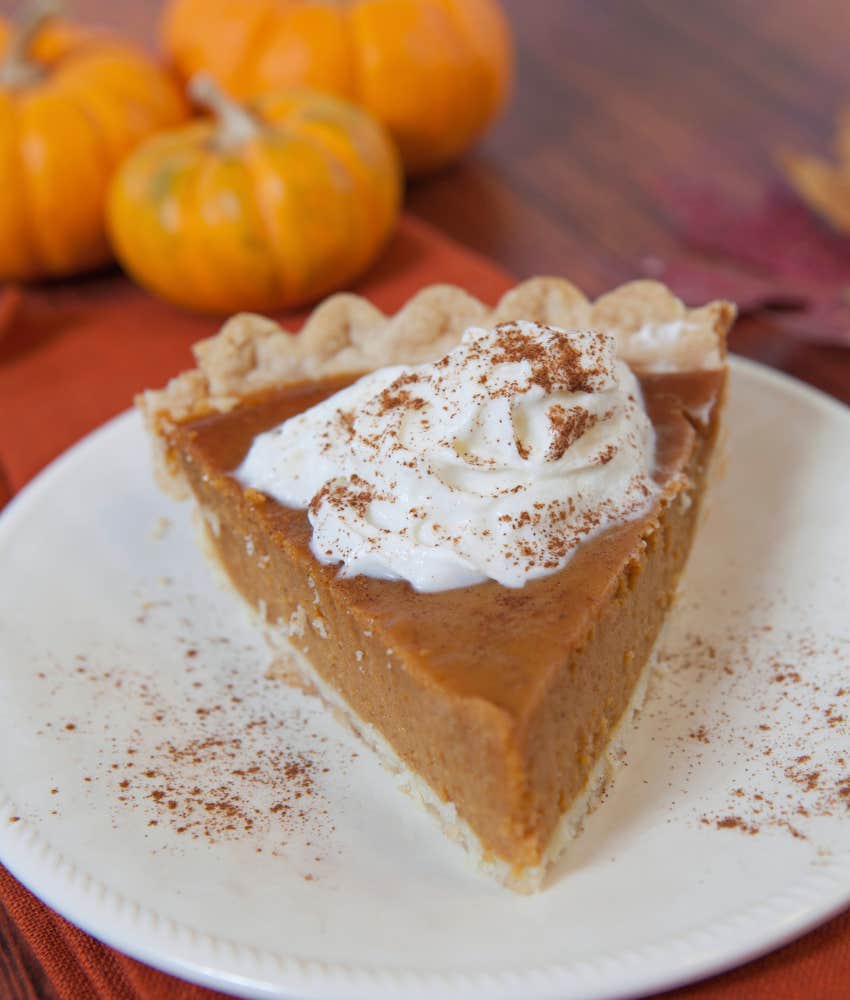 slice of pumpkin pie with whipped cream