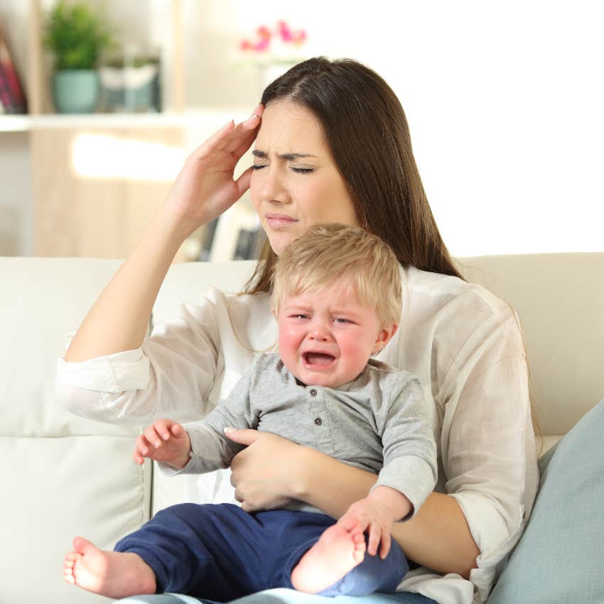 Tired mom with crying toddler