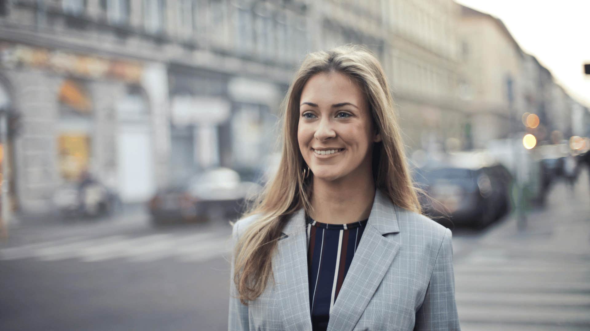 woman in a suit smiling