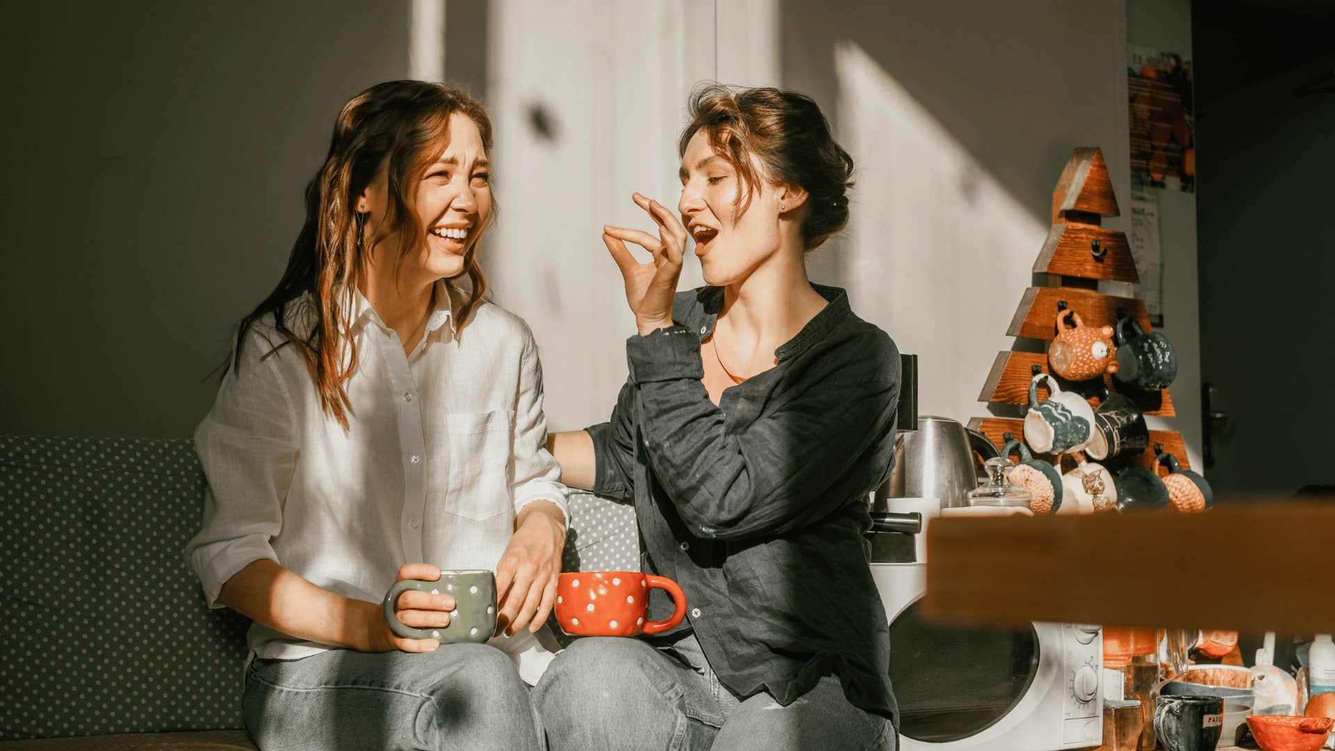 woman playfully feeding friend