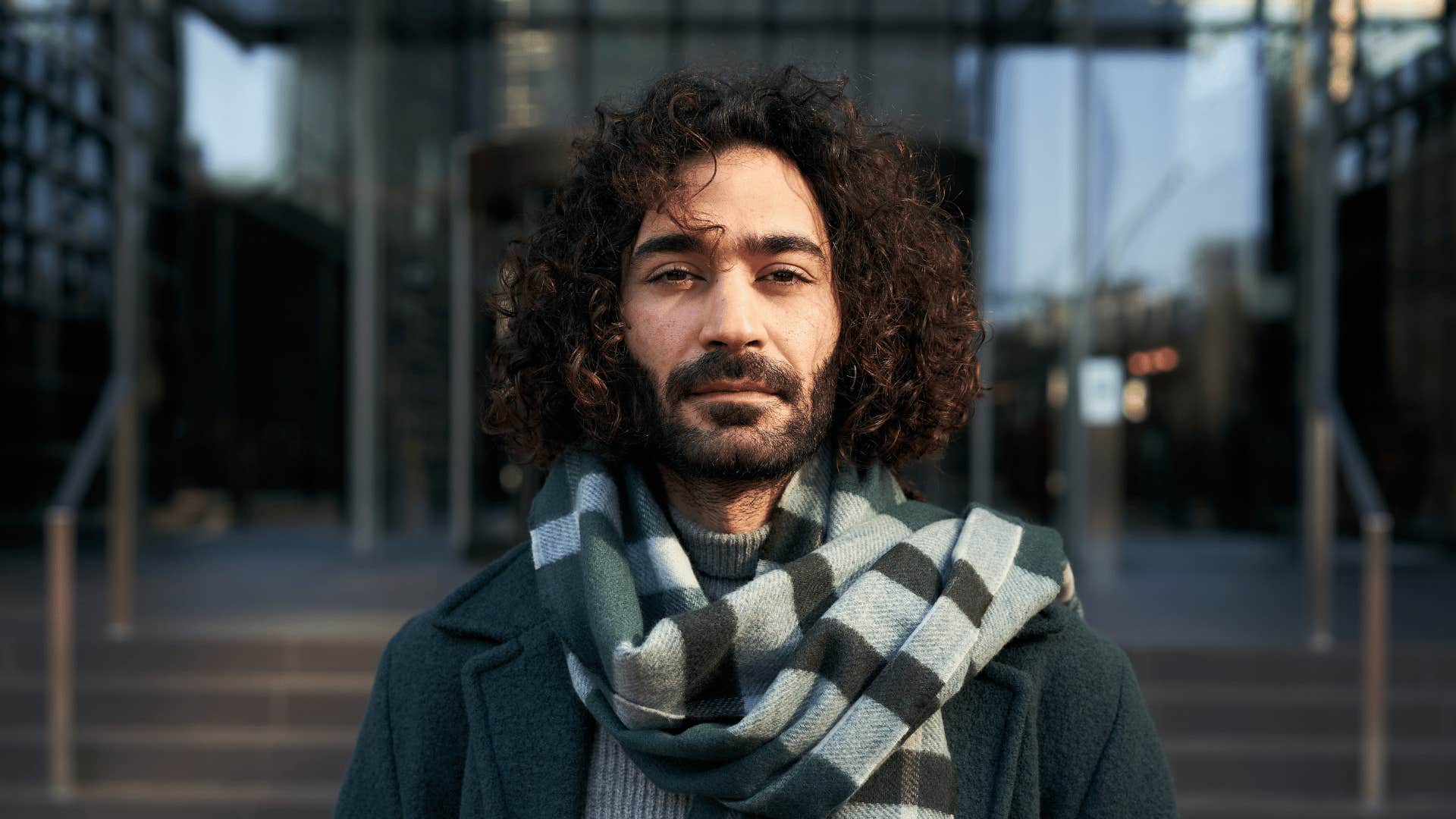 serious arrogant man in a scarf