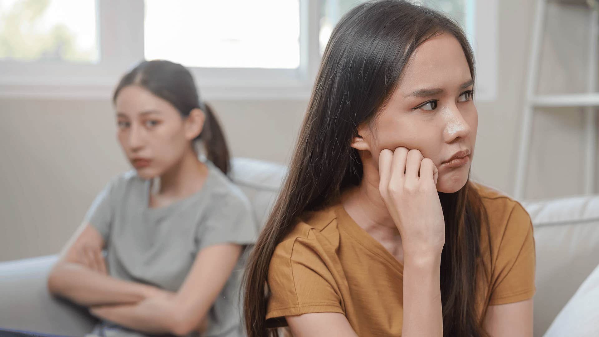 two women ignoring each other