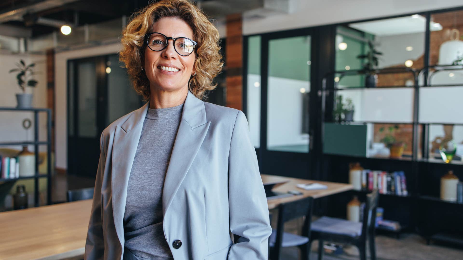 Professional woman smiling in her office.