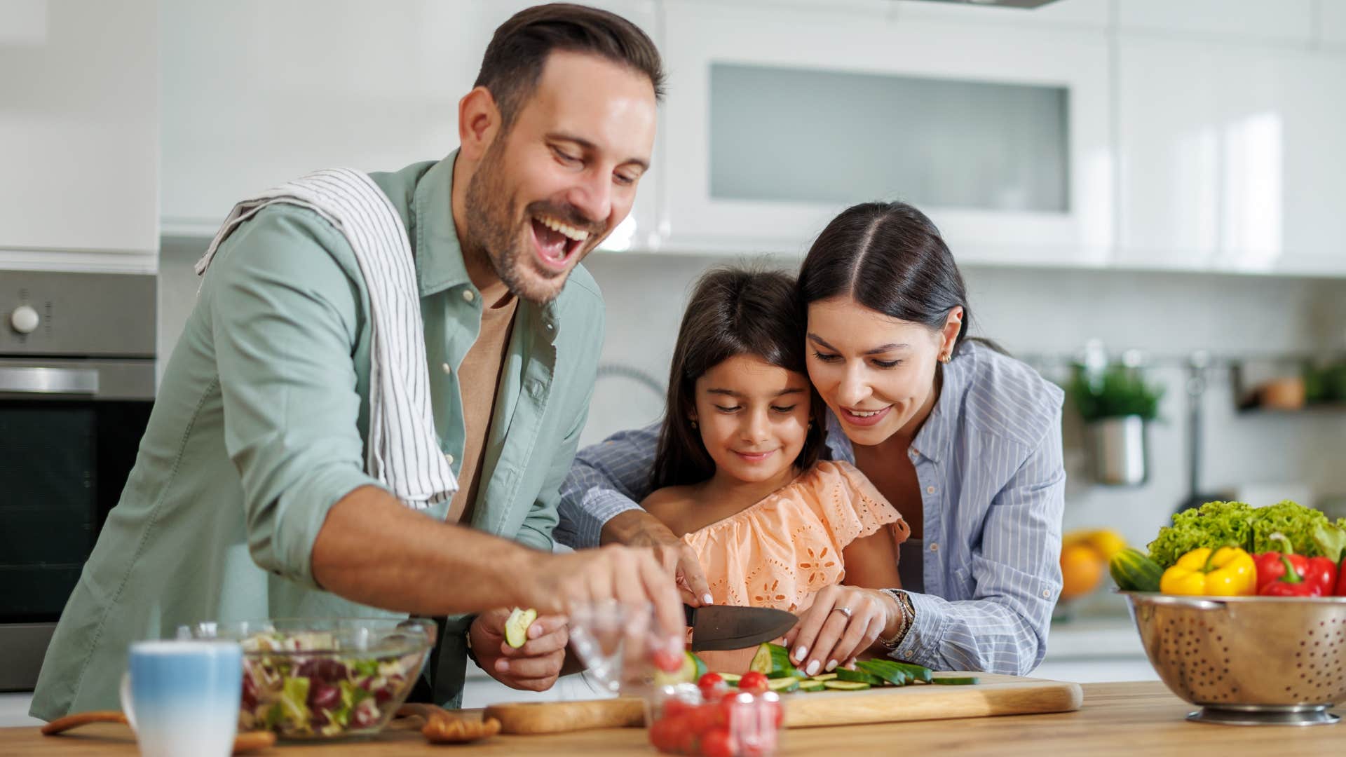 Smiling family cooking together in the kitchen