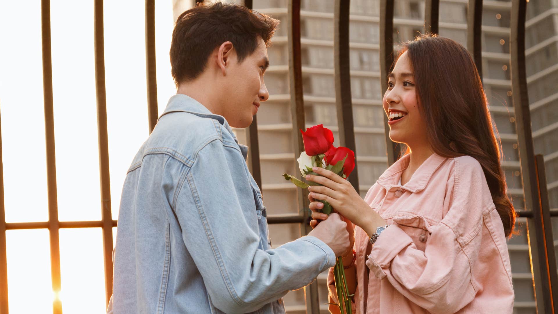 Man giving his date a flower