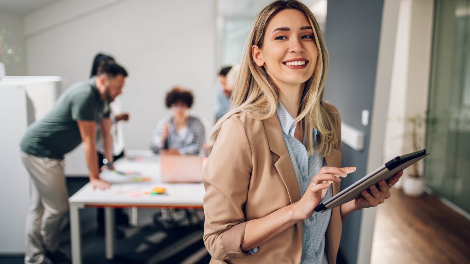 Professional woman smiling in her office.