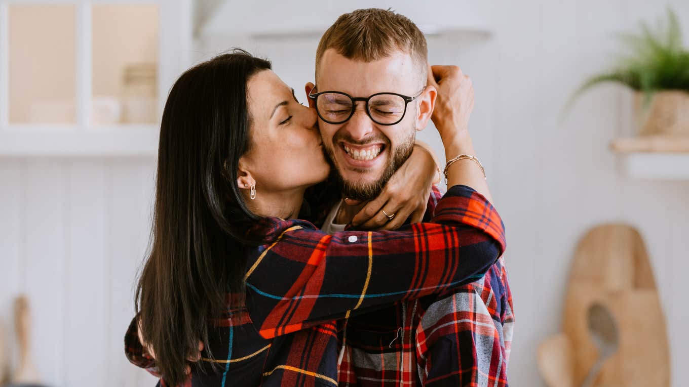 Woman being overly lovey towards boyfriend. 