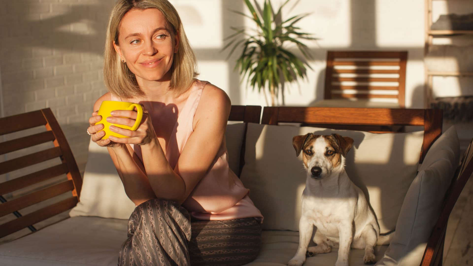 Gen X woman sitting at home with her dog