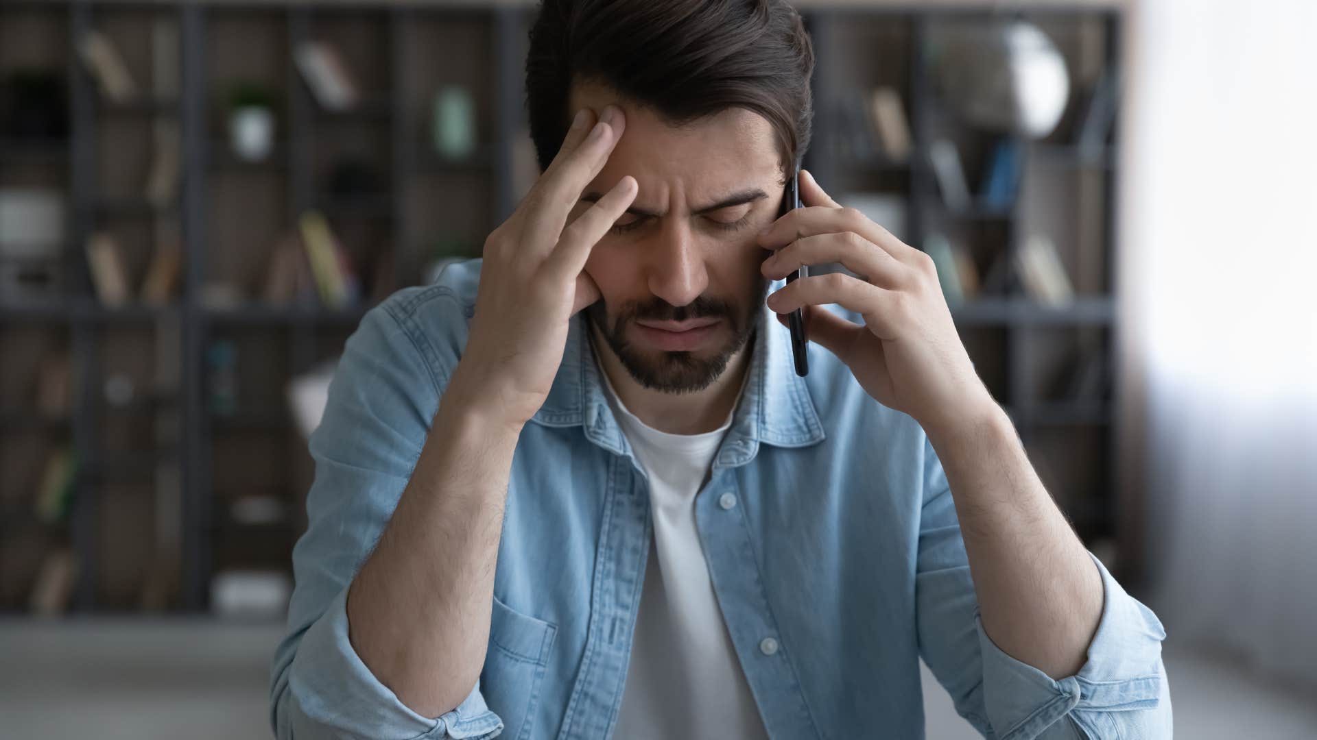 Man looking annoyed on the phone