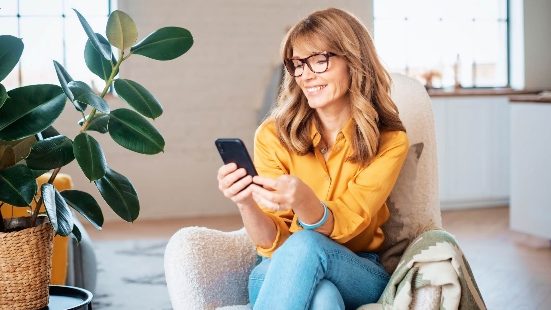 Older woman scrolling on her phone