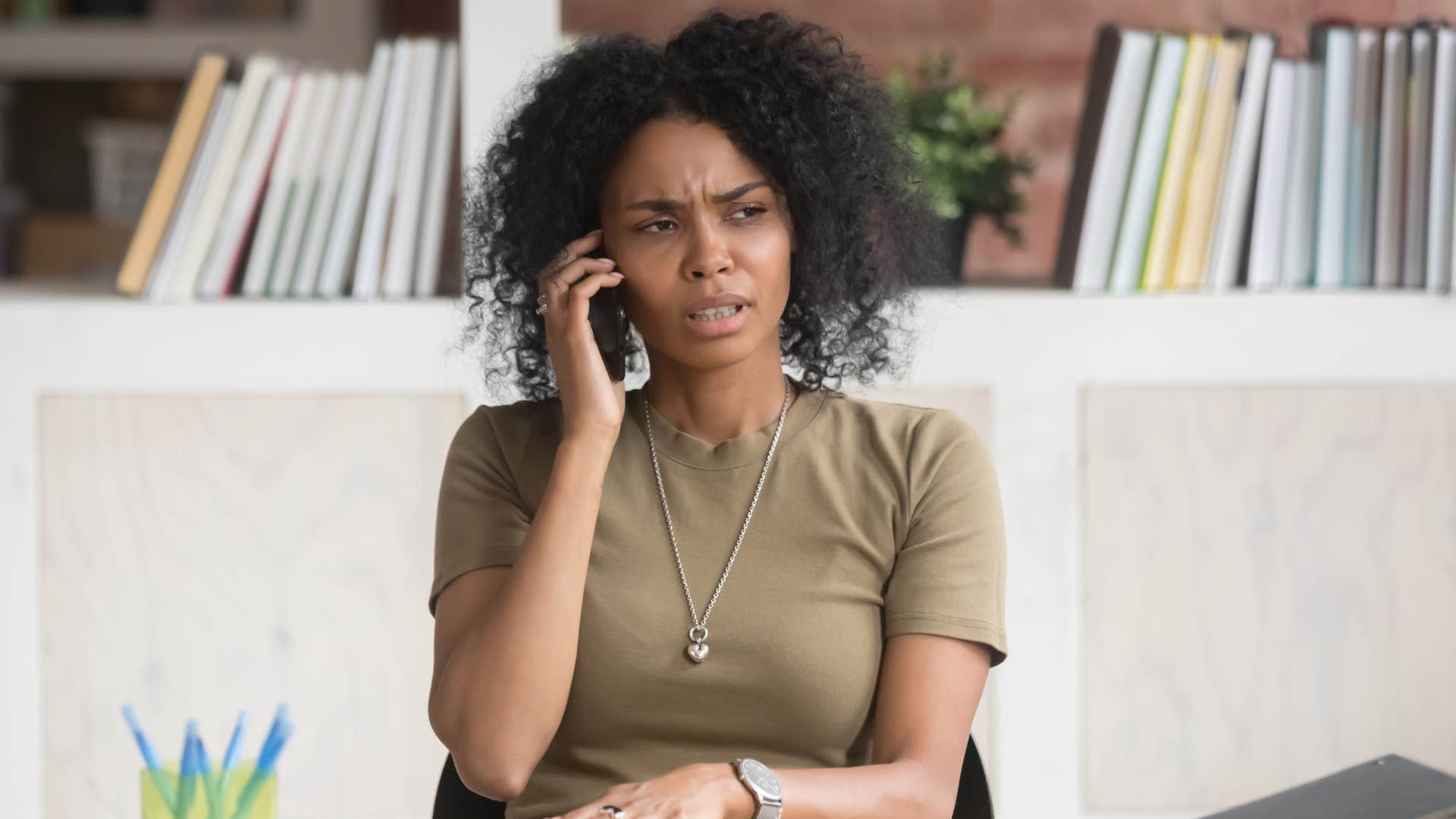 Woman looking annoyed talking on her phone