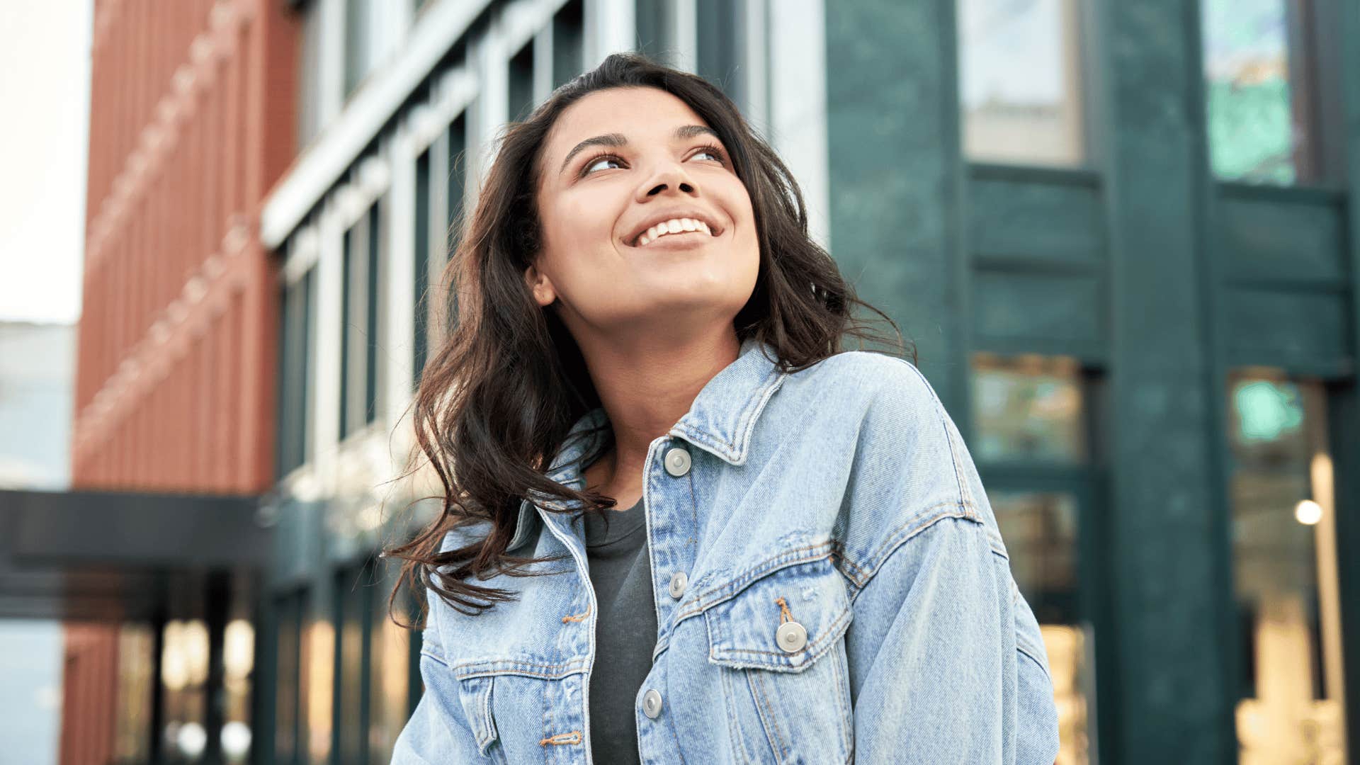 woman smiling while in the city