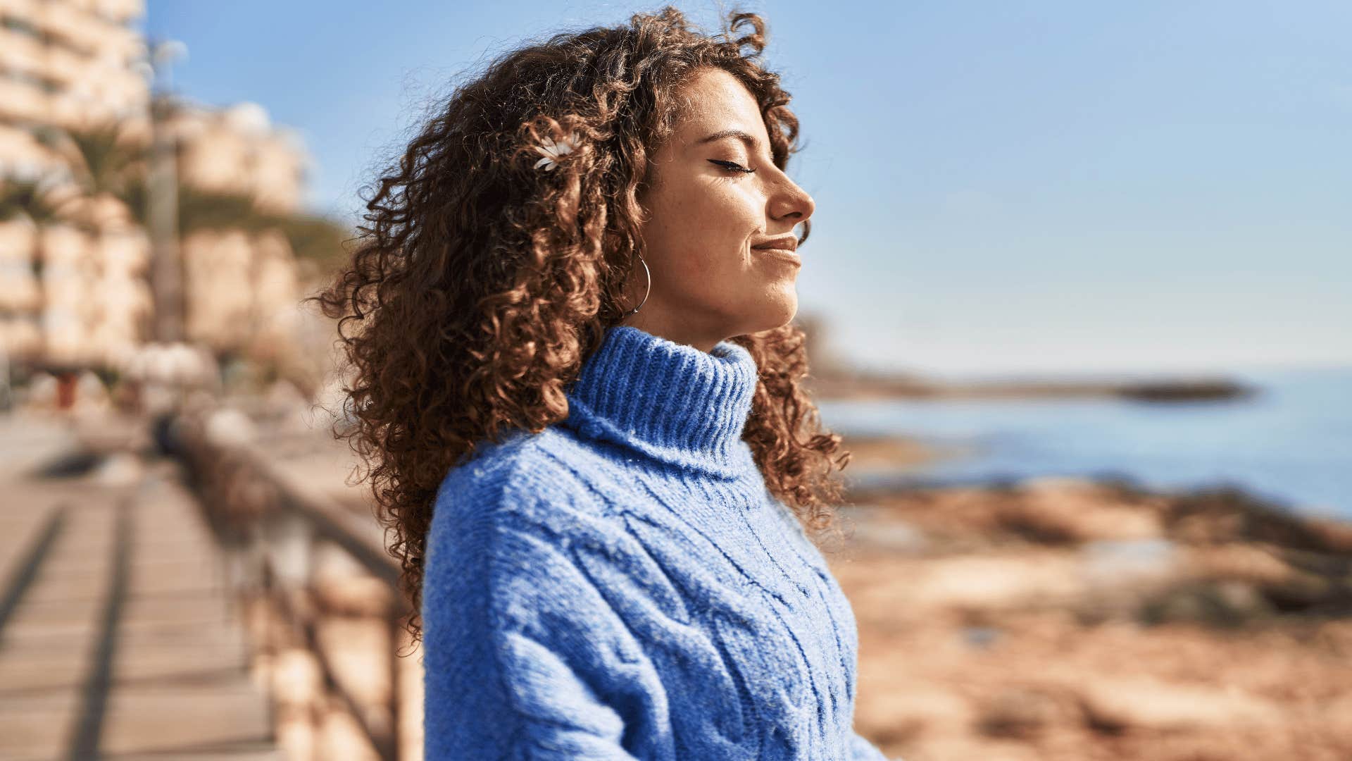 woman deep breathing outside 