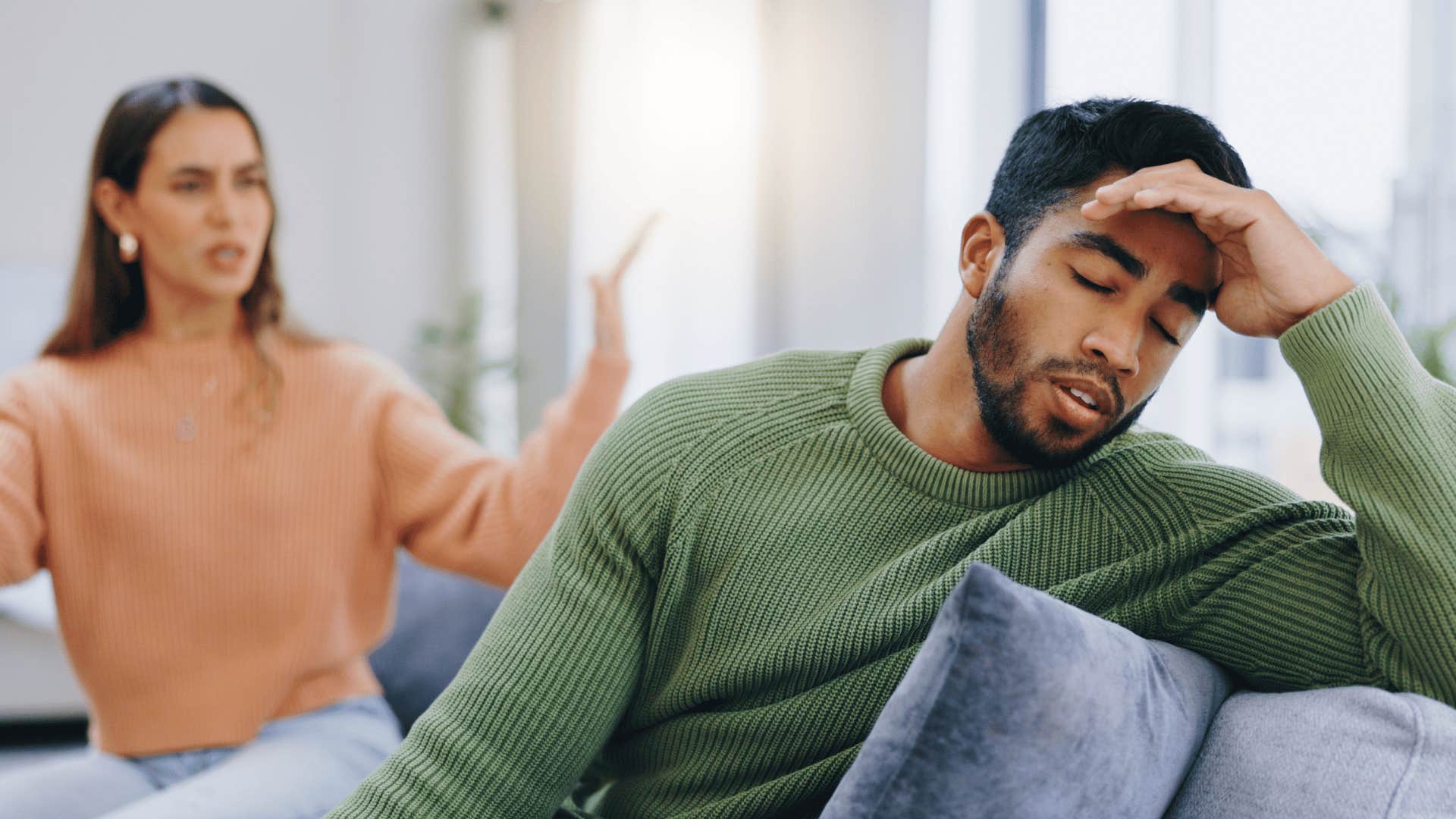 couple arguing on couch