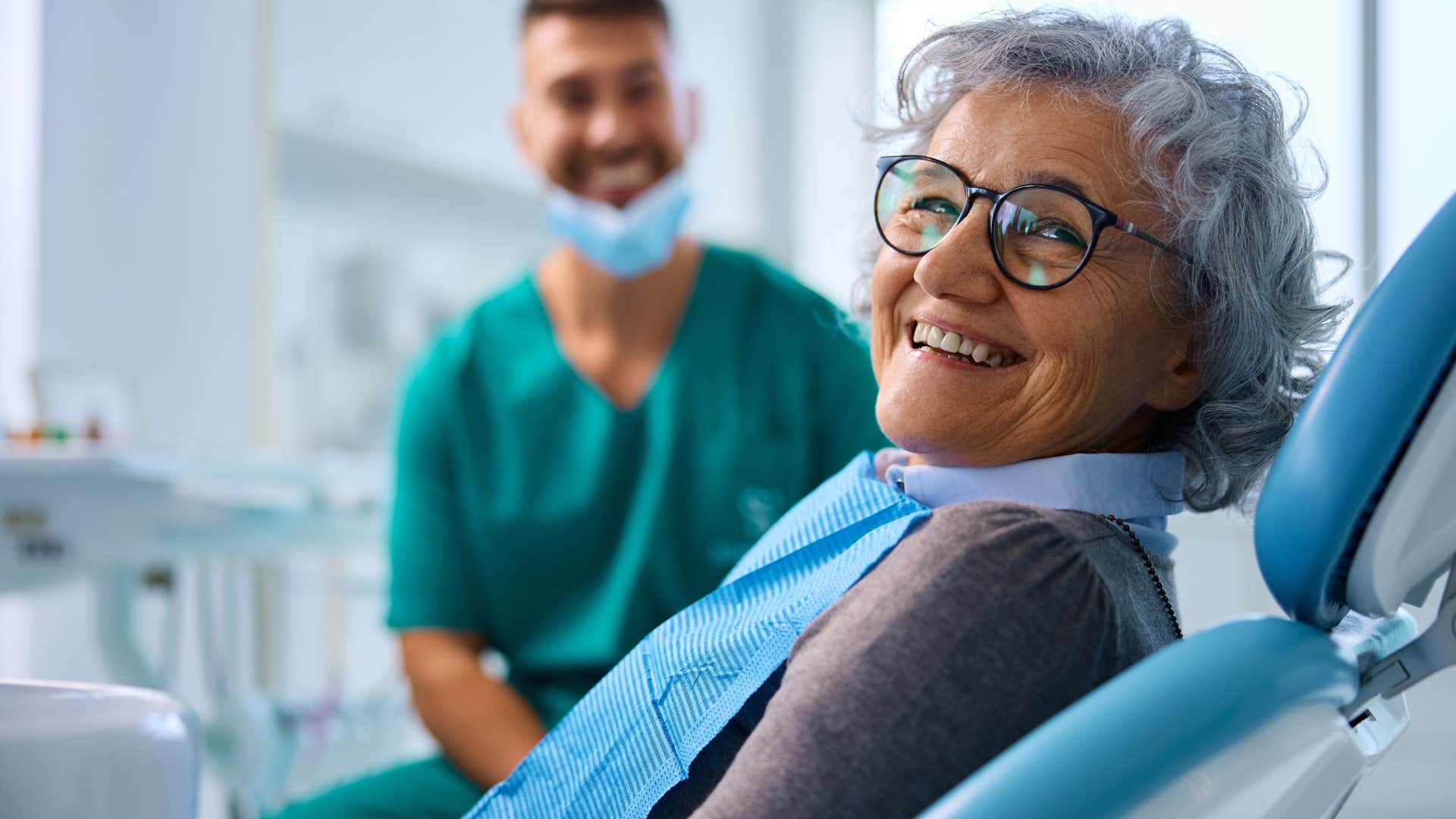 Woman smiling in a dentist office chair